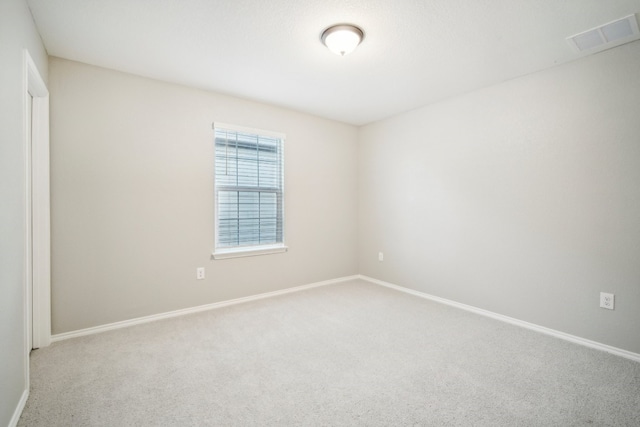 unfurnished room featuring carpet floors