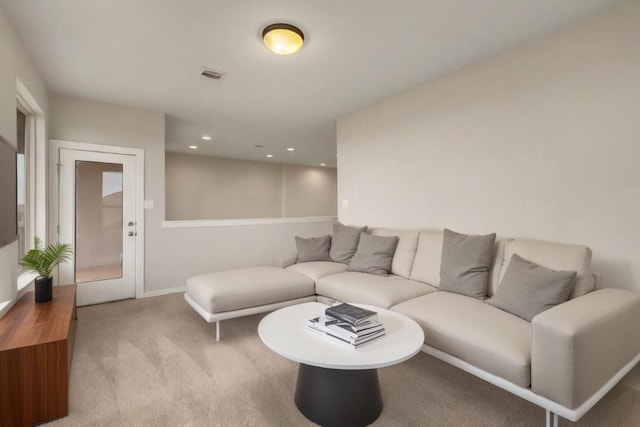 living room featuring baseboards, carpet floors, visible vents, and recessed lighting