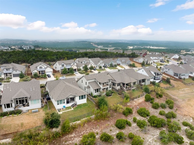 birds eye view of property with a residential view