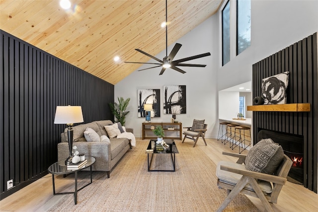 interior space with high vaulted ceiling, wooden ceiling, ceiling fan, and light hardwood / wood-style flooring