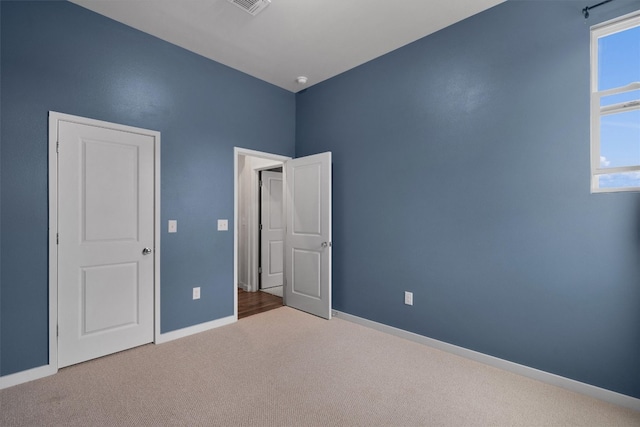 unfurnished bedroom with carpet flooring