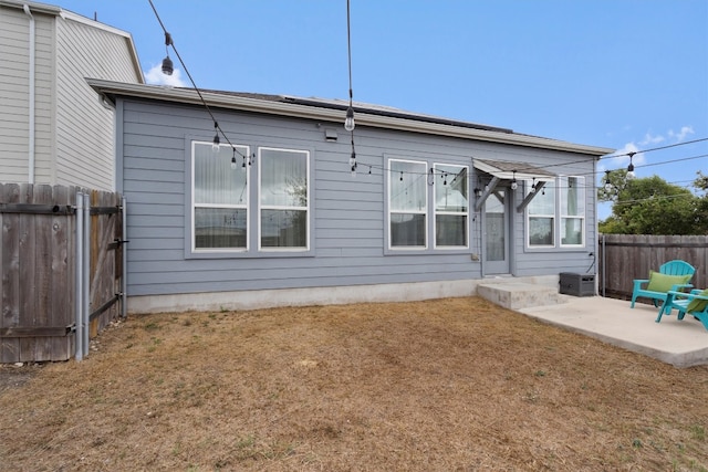 back of house with a patio area