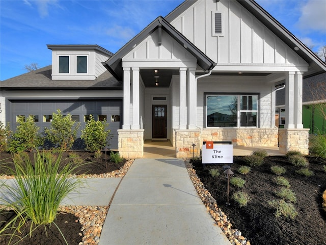 view of front of property featuring a garage and covered porch