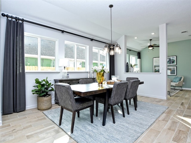 dining area with light hardwood / wood-style floors and ceiling fan