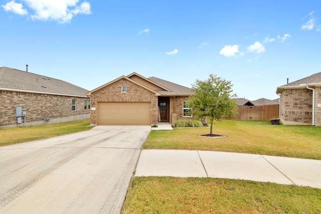 view of front of property featuring a front lawn and a garage