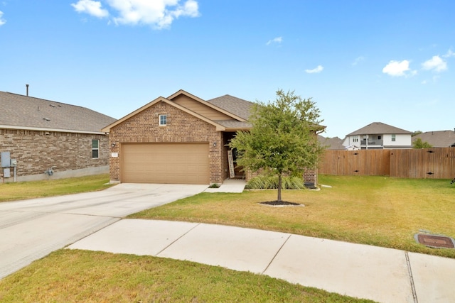 view of front of house featuring a garage and a front lawn