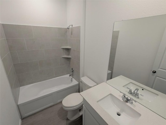 903 Bobby Lou Ln, Copperas Cove, TX 76522 - full bath with toilet, washtub / shower combination, vanity, and wood finished floors