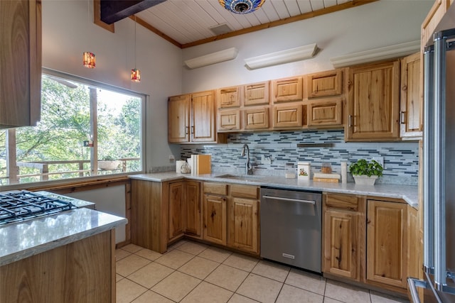 kitchen featuring crown molding, backsplash, appliances with stainless steel finishes, decorative light fixtures, and light tile patterned floors