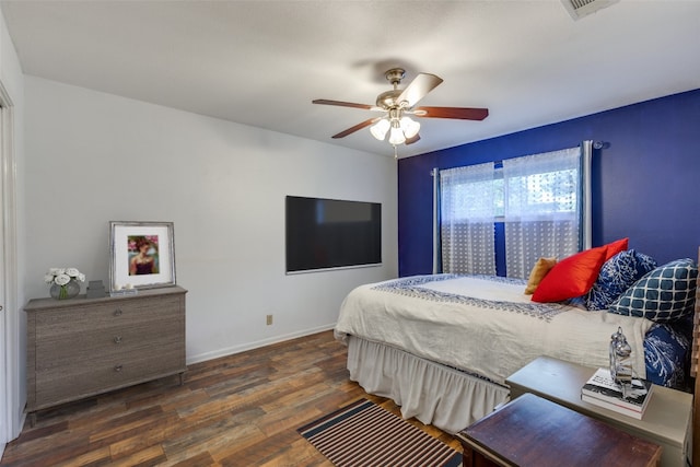 bedroom featuring ceiling fan and dark hardwood / wood-style floors