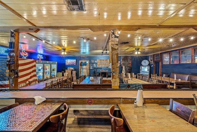 interior space featuring ceiling fan and wood ceiling