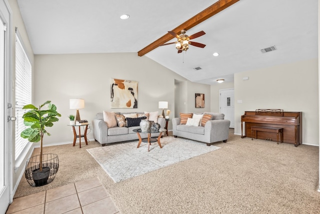 carpeted living room featuring ceiling fan and vaulted ceiling with beams