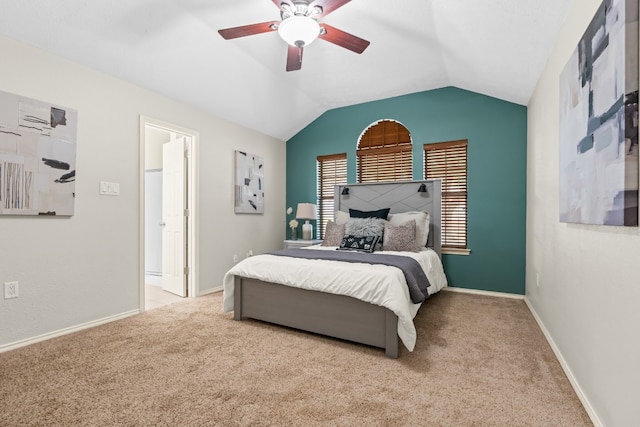 bedroom featuring lofted ceiling, ceiling fan, and light carpet