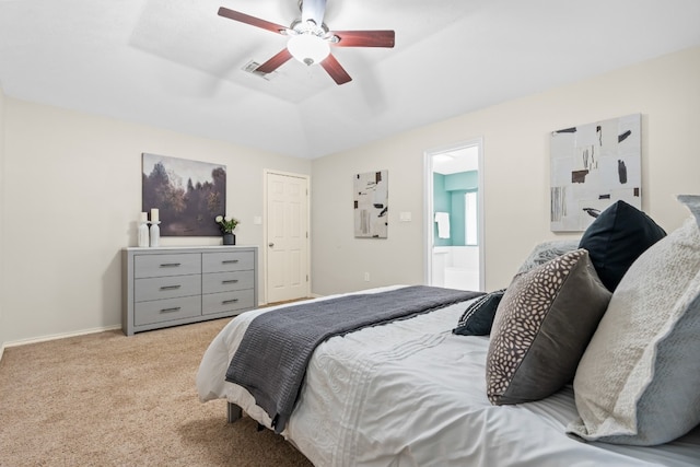 carpeted bedroom featuring lofted ceiling, ceiling fan, and connected bathroom