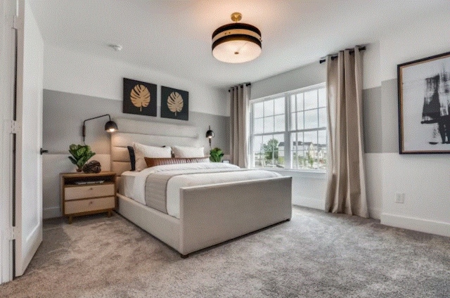 carpeted bedroom with a textured ceiling