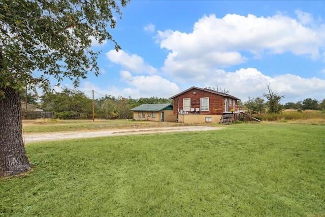 537 Leisure Ln, Cedar Creek, TX 78612 - view of grassy yard featuring driveway