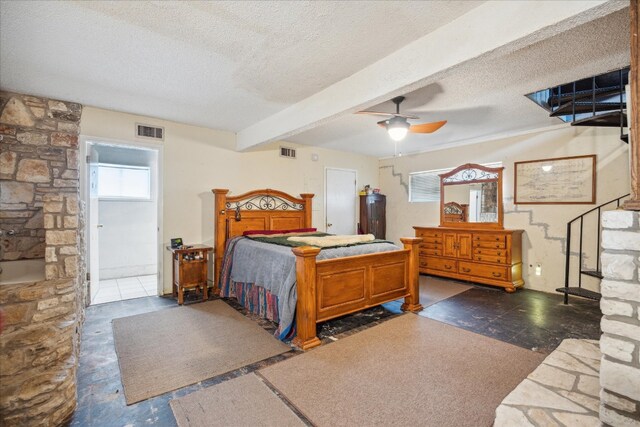 bedroom featuring ensuite bathroom, a textured ceiling, ceiling fan, and beam ceiling