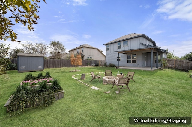 view of yard featuring a patio and a fire pit