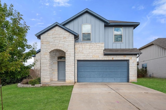 view of front facade with a front yard and a garage