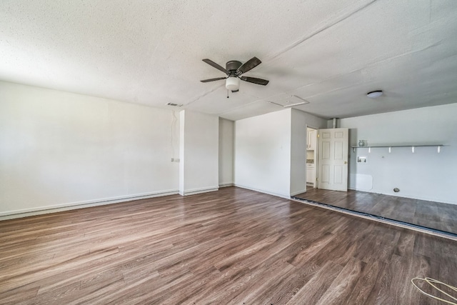 unfurnished room with wood-type flooring, a textured ceiling, and ceiling fan