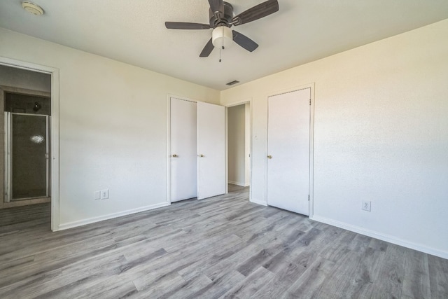 unfurnished bedroom with ceiling fan and light hardwood / wood-style flooring