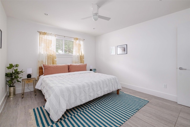 bedroom featuring ceiling fan and light hardwood / wood-style floors