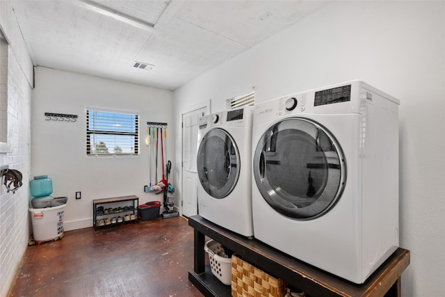 laundry area with washer and dryer