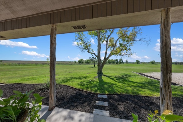 view of yard with a rural view