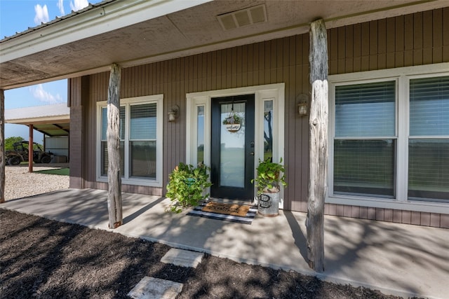 doorway to property with a porch