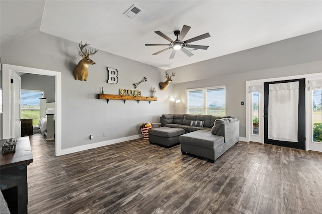 living room with lofted ceiling, ceiling fan, a healthy amount of sunlight, and dark hardwood / wood-style floors