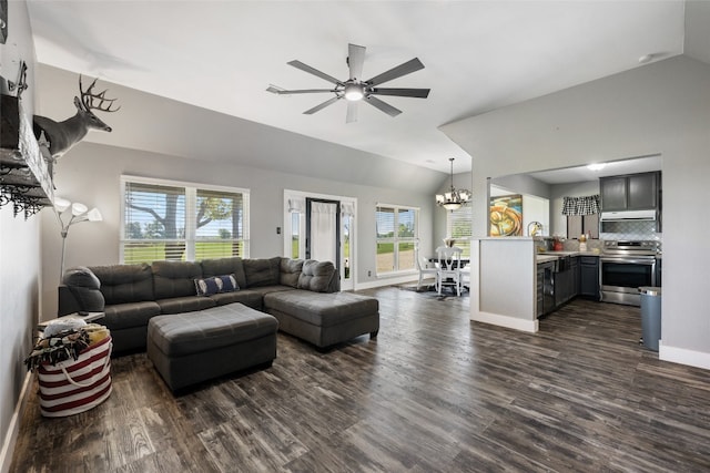 living room featuring plenty of natural light, dark wood-type flooring, and lofted ceiling