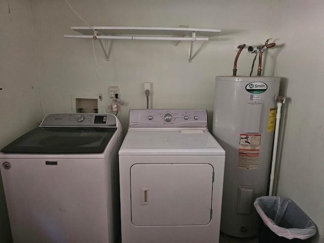 laundry area with separate washer and dryer and water heater