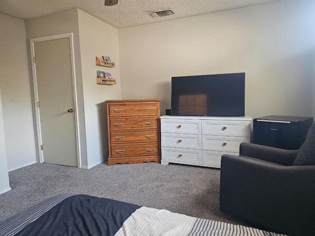 carpeted bedroom featuring a textured ceiling