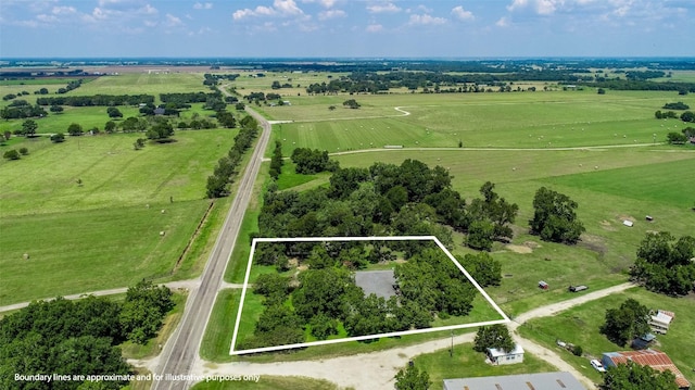 birds eye view of property featuring a rural view