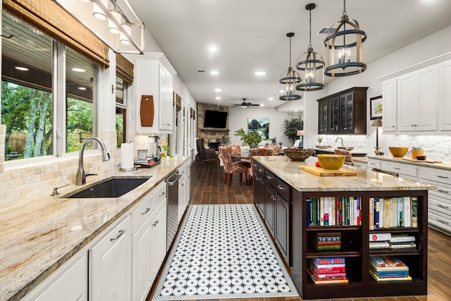 kitchen featuring sink, white cabinets, and dark wood-type flooring