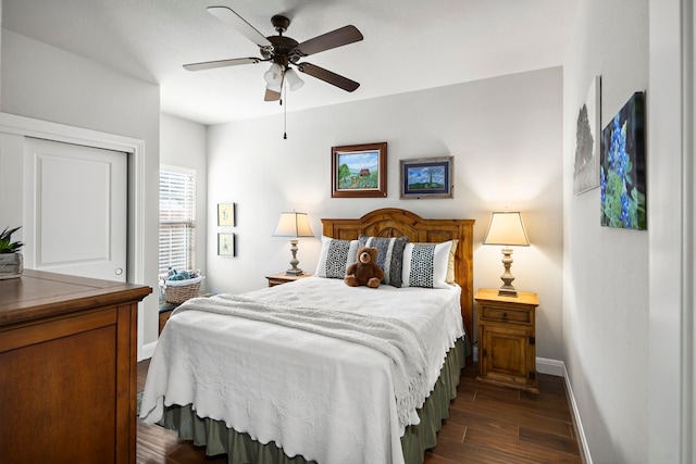 bedroom featuring dark hardwood / wood-style floors and ceiling fan