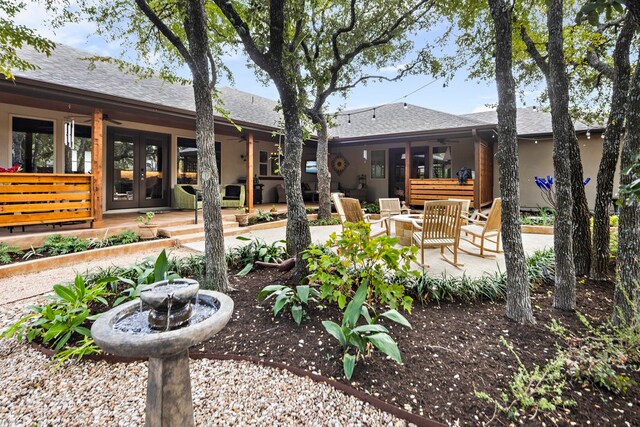 exterior space featuring ceiling fan