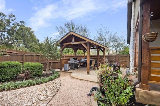 view of patio / terrace featuring a gazebo and grilling area