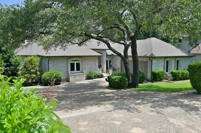 ranch-style house featuring a garage