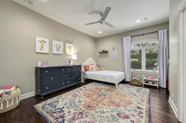 bedroom with ceiling fan and dark hardwood / wood-style floors