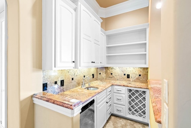 kitchen with light stone counters, ornamental molding, sink, white cabinets, and stainless steel dishwasher