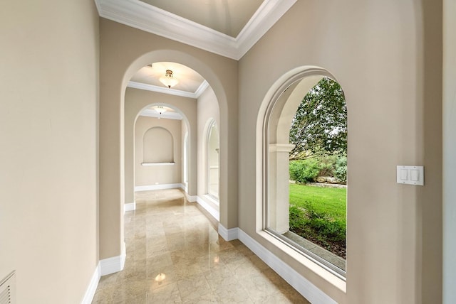 corridor with a wealth of natural light and crown molding