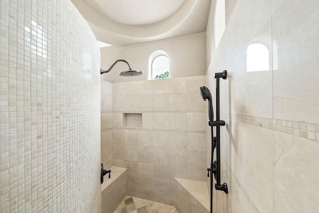 bathroom featuring a tile shower