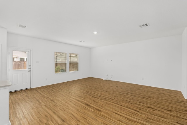 spare room featuring light hardwood / wood-style flooring