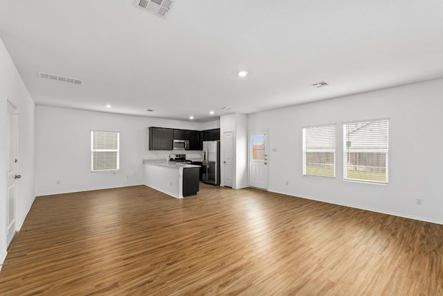 unfurnished living room with hardwood / wood-style flooring