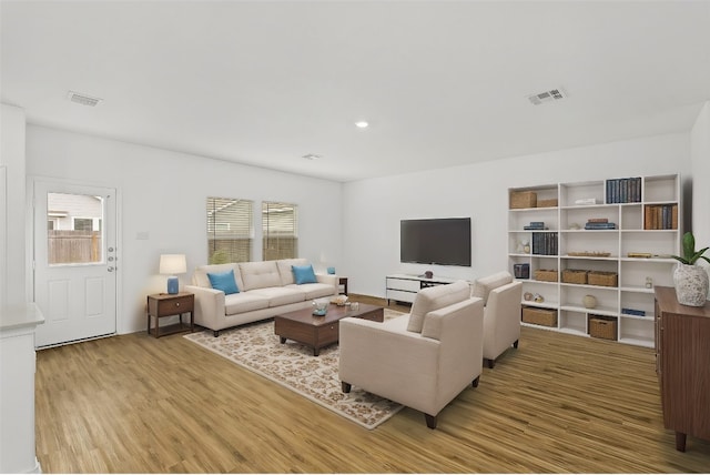 living room with light hardwood / wood-style floors