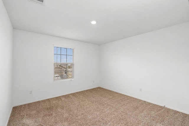 unfurnished room with carpet floors