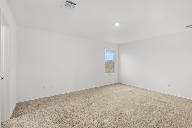 unfurnished room with carpet floors