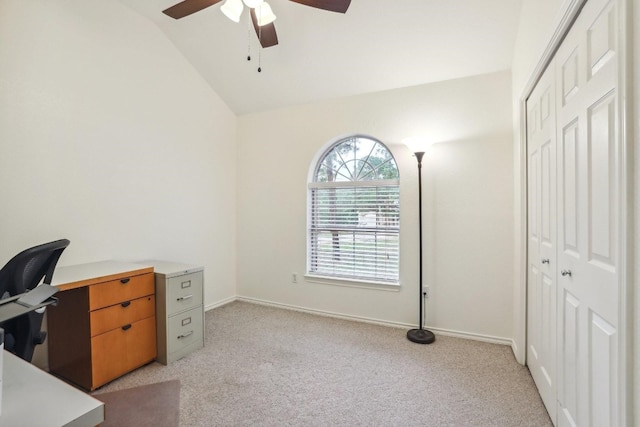 carpeted office featuring lofted ceiling and ceiling fan