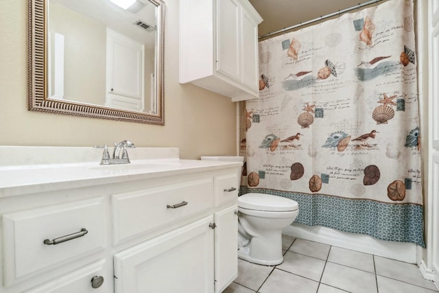 bathroom with toilet, vanity, tile patterned floors, and a shower with curtain