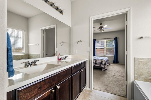 bathroom with tile patterned flooring, a wealth of natural light, vanity, and ceiling fan